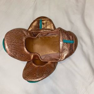 Rose gold tieks.